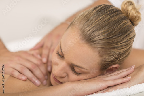 beautiful young woman relaxing in the spa salon