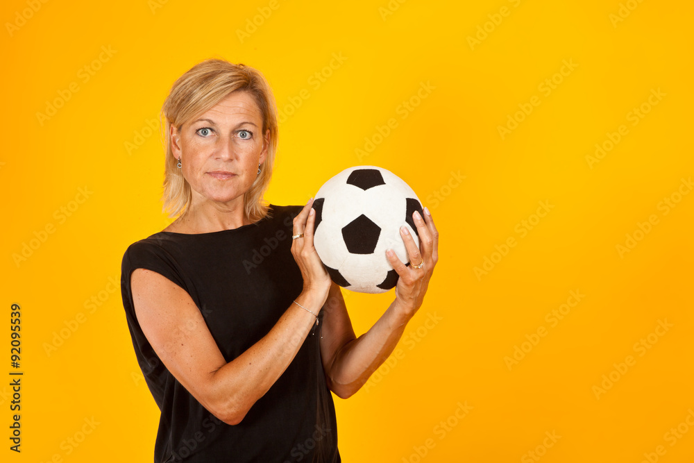 woman playing with a soccer ball