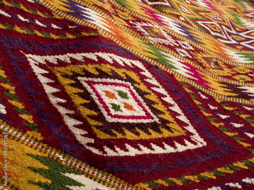 Close up of handmade traditional wool rug Close up of handmade traditional wool rug