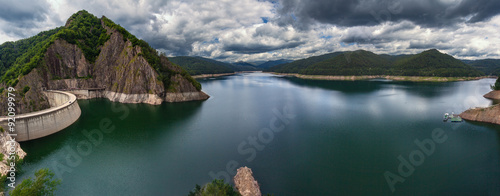 Mountain landscape panorama with dam and lake photo