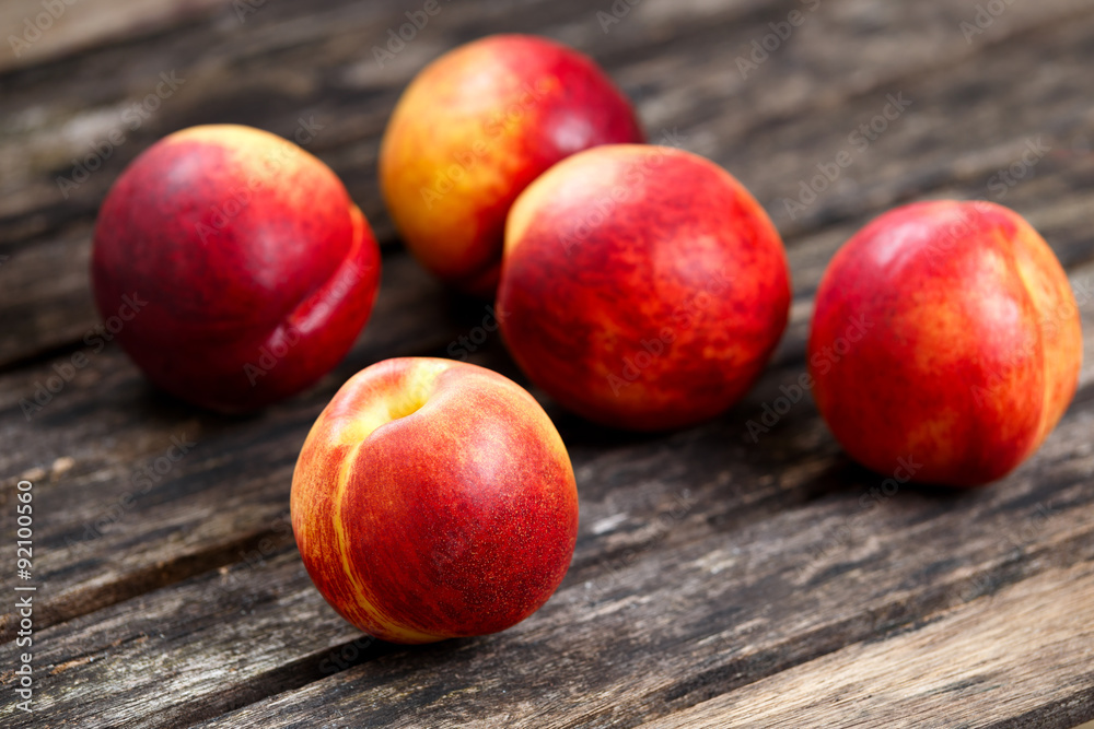 Fresh juicy Nectarine Fruit close up, on old wooden table. background. selected focus Fresh juicy Nectarine Fruit close up, on old wooden table. background. selected focus