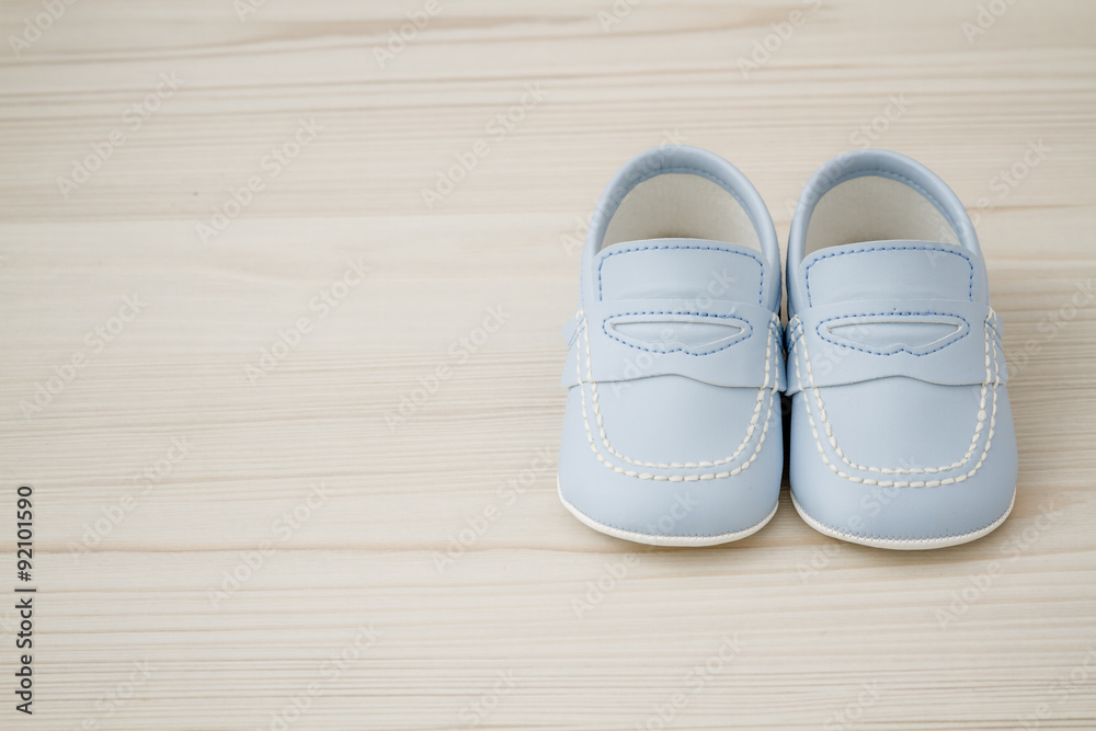 Pair of Classic Blue Baby Shoes on Grey background with Copy Space Pair of Classic Blue Baby Shoes on Grey background with Copy Space