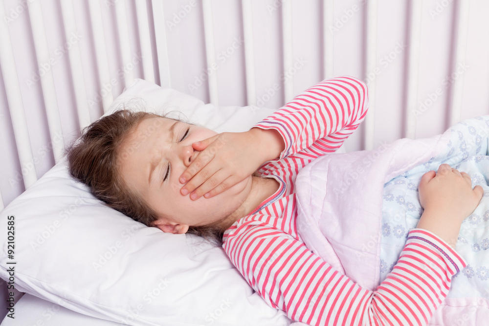 cute little girl yawning in her bed cute little girl yawning in her bed