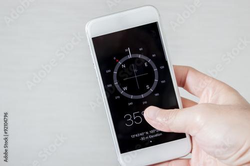 Compass on a smart phone in a white background