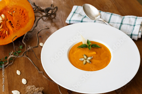 pumpkin cream soup with basil leaf