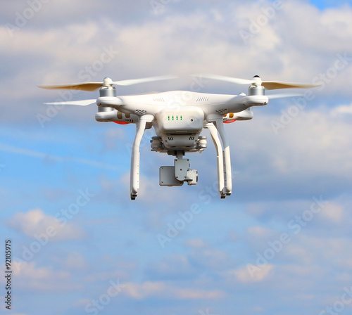 Drone quadrocopter with high resolution digital camera. New tool for aerial photo and video. 