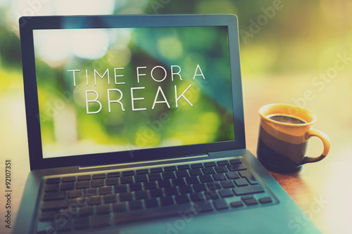 Coffee break at morning concept with laptop serene morning vintage editing style photo