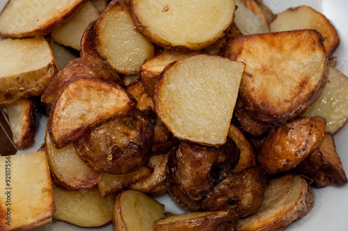 Freshly fryied young potatoes photo
