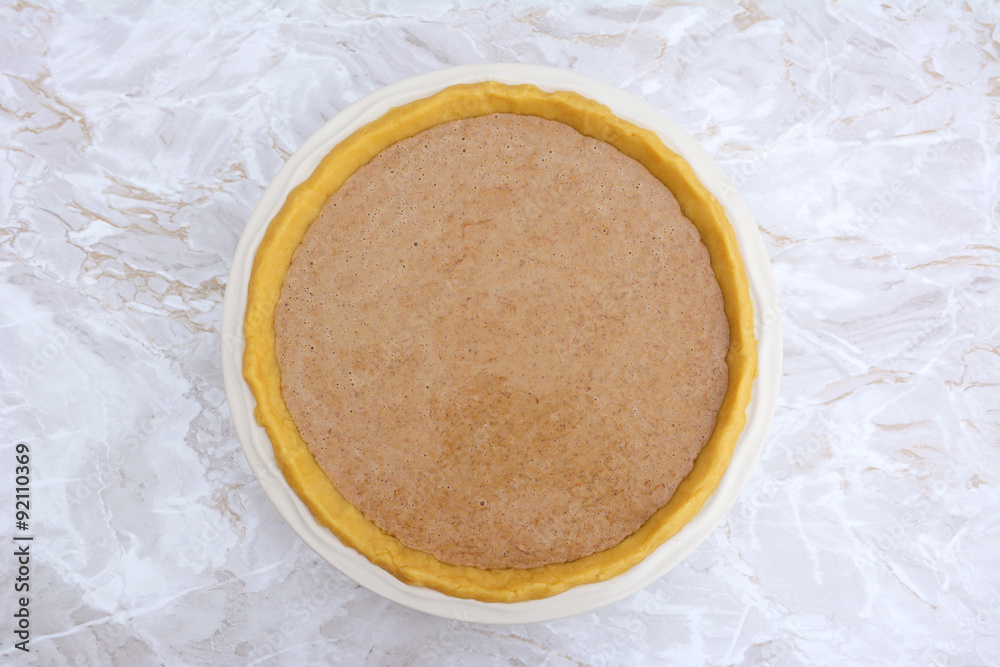 Pumpkin pie ready to be baked