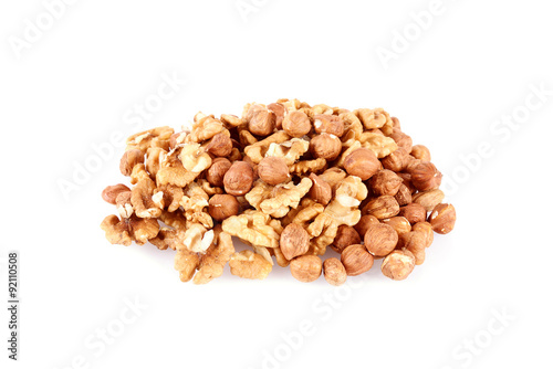 Pile of walnut kerneks and peeled hazelnuts isolated
