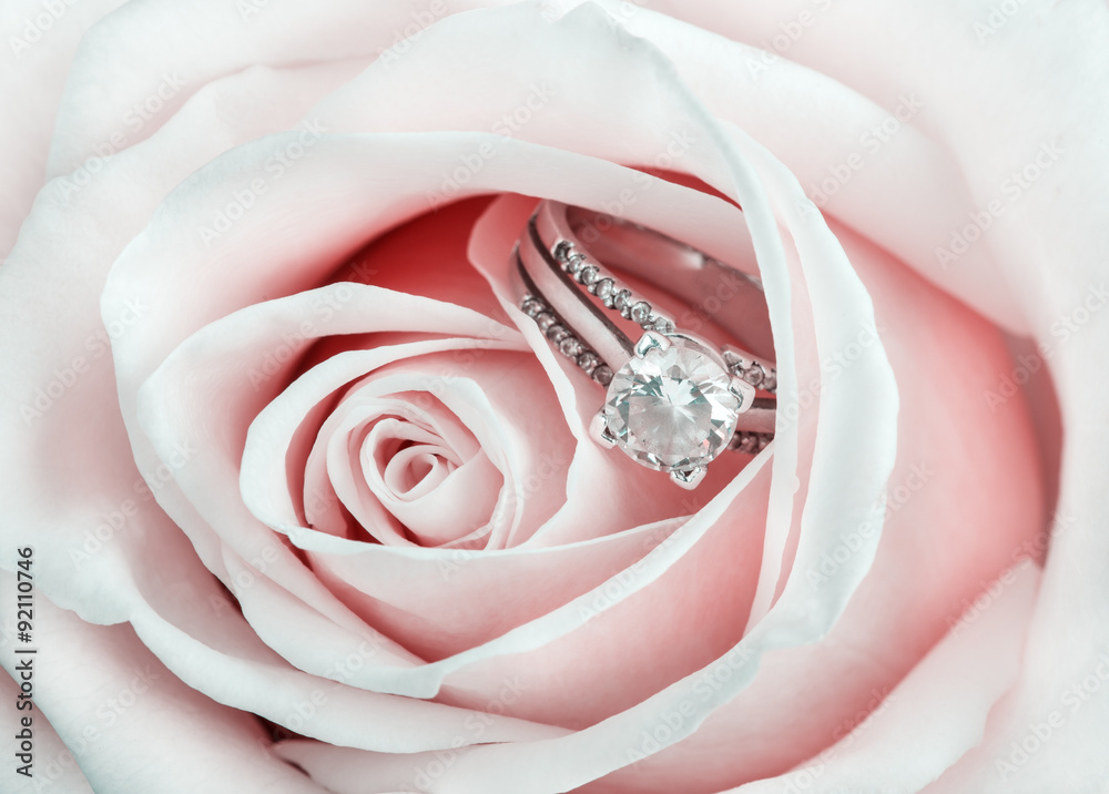 Obraz premium Pink Rose and diamond ring nestled inside. Macro closeup