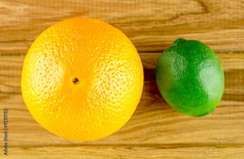 Orange and lime on rustic background