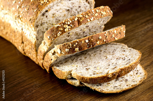 Macro closeup of rustic slices whole wheat multi grain bread on