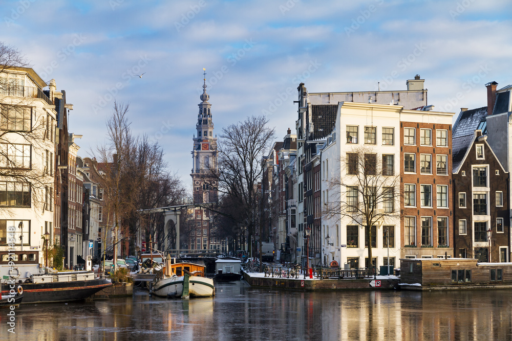 Beautiful winter view on the Groenburgwal and the Southern church in Amsterdam, the Netherlands. 
