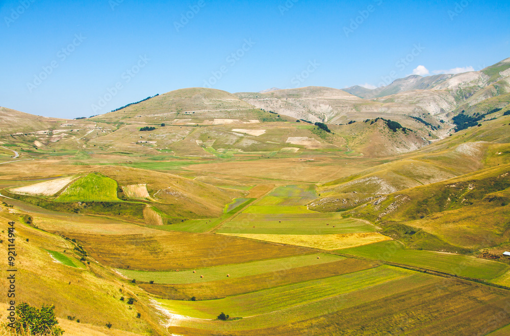 Coloured fields and mountains in Castelluccio di Norcia in a sum