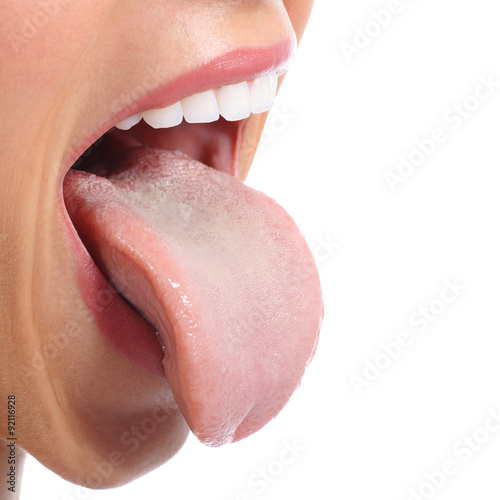 Fototapeta Close up of a woman mouth sticking tongue