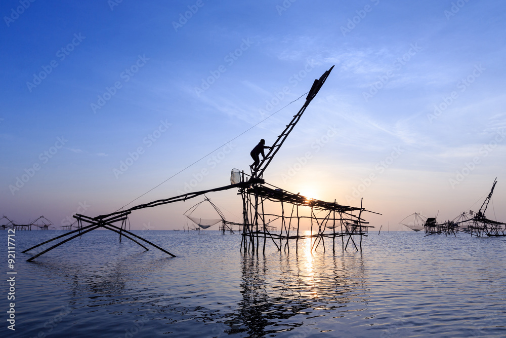 Traditional asia fishing net on sunrise.