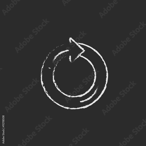 Circular arrow icon drawn in chalk.