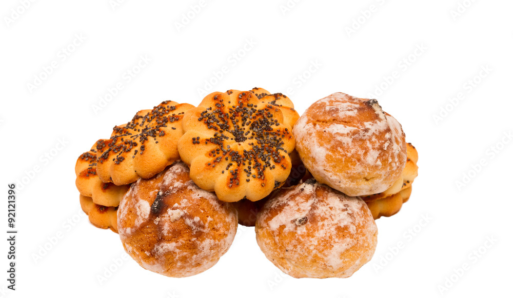 Round sugar cookies with poppy seeds on a white background. Round sugar cookies with poppy seeds on a white background.