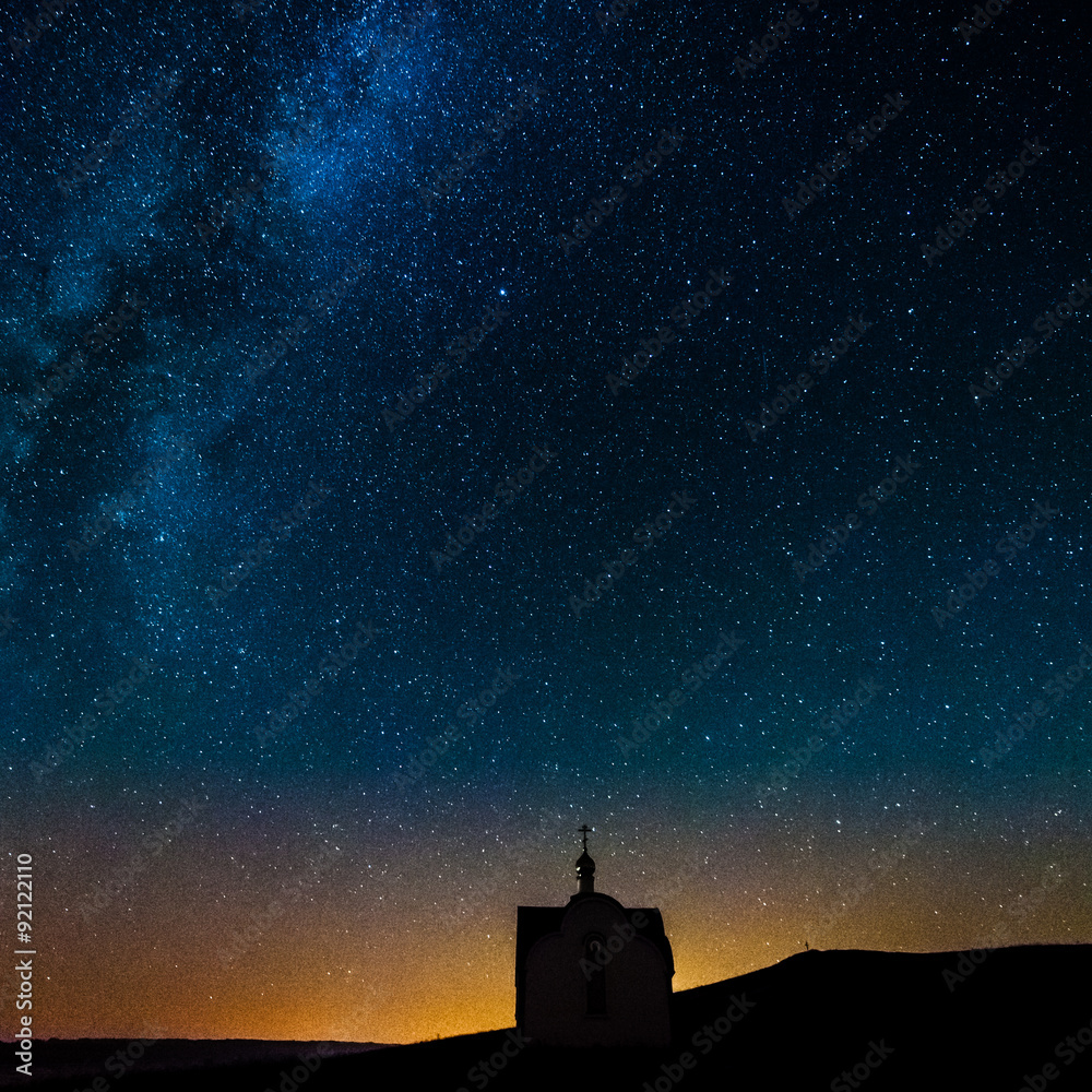 Temple in the night sky and the Milky Way, the silhouette of the church on the background of the Milky Way