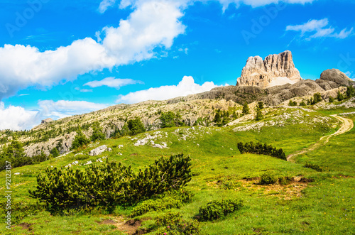 Tableau sur toile Monte Averau, green meadows in Dolomites