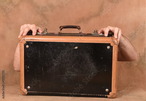 Man holding a suitcase photo