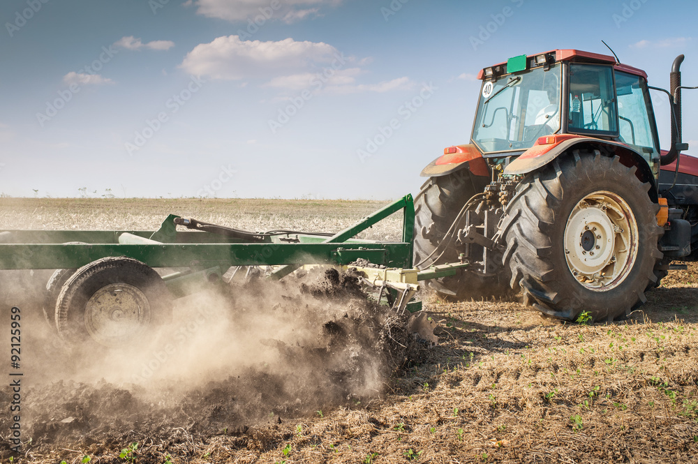 Fototapeta premium Tractor plowing