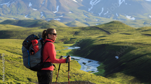 Female hiker enjoying the landscape of the Laugavegur hiking trail on Iceland.