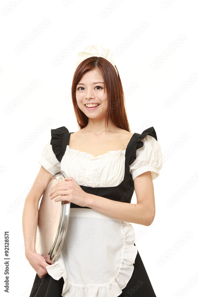 young Japanese woman wearing french maid costume with tray young Japanese woman wearing french maid costume with tray