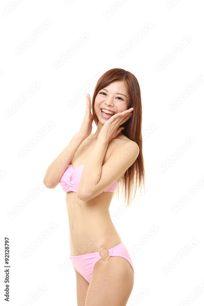 young Japanese woman in a pink bikini pleased young Japanese woman in a pink bikini pleased