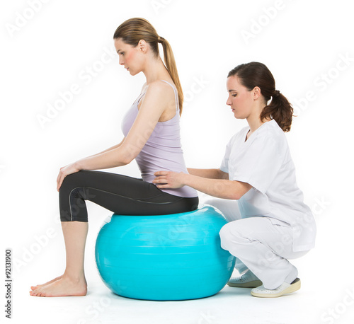 doctor with medical ball and woman patient