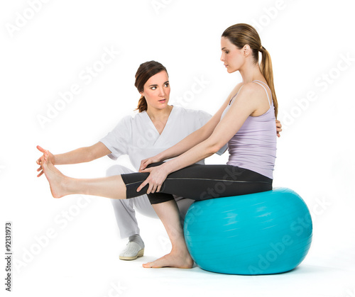 doctor with medical ball and woman patient
