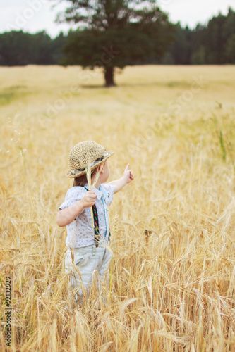 boy walking on a field of rye   © stopabox
