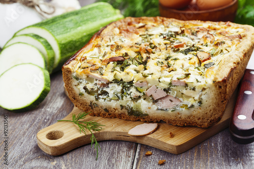 Pie with zucchini, sausage and herbs
