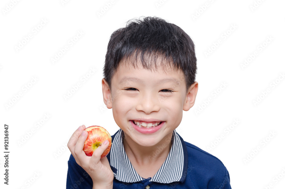Asian boy eating an apple over white background Asian boy eating an apple over white background