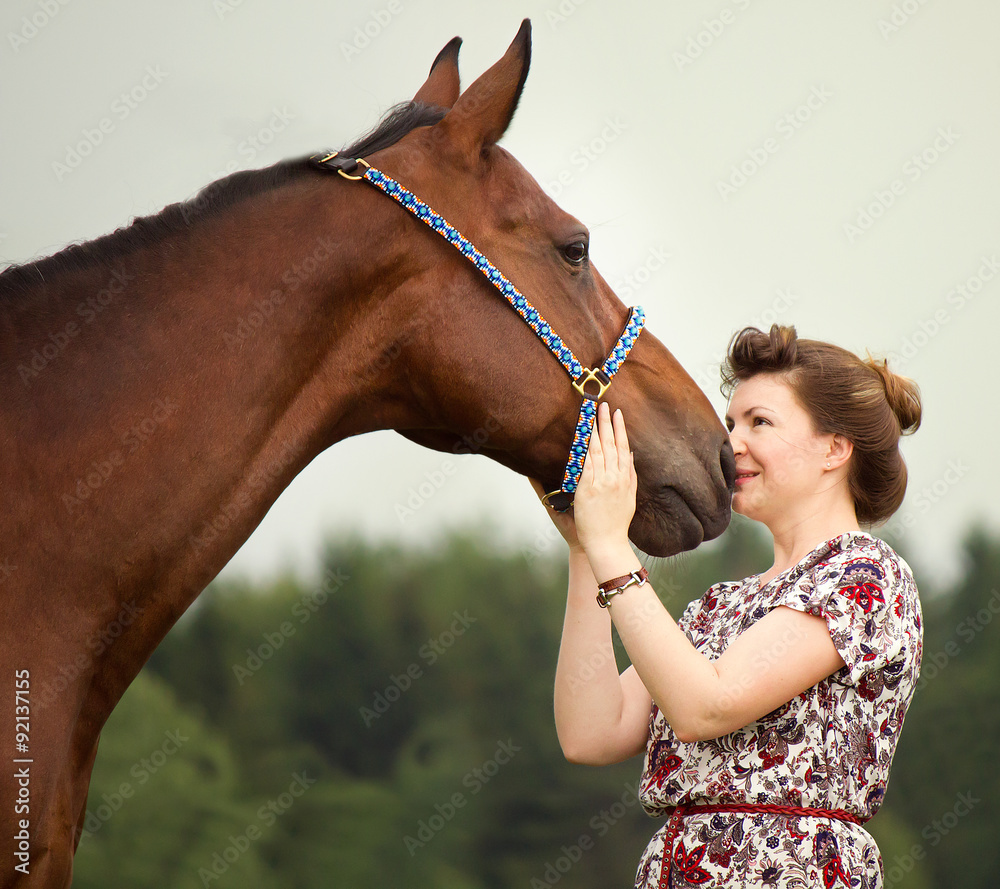 Beautiful girl talking with her free horse
 - obrazy, fototapety, plakaty 