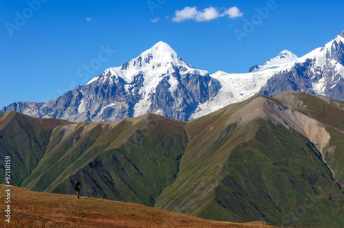 Young tourist walks on top overlooking the valley