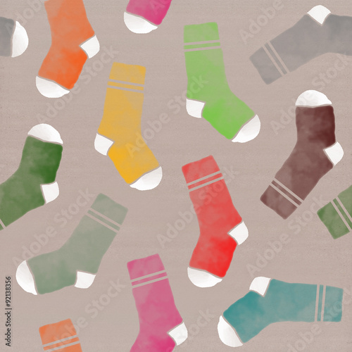 Multi-colored socks in a seamless pattern on paper cardboard background