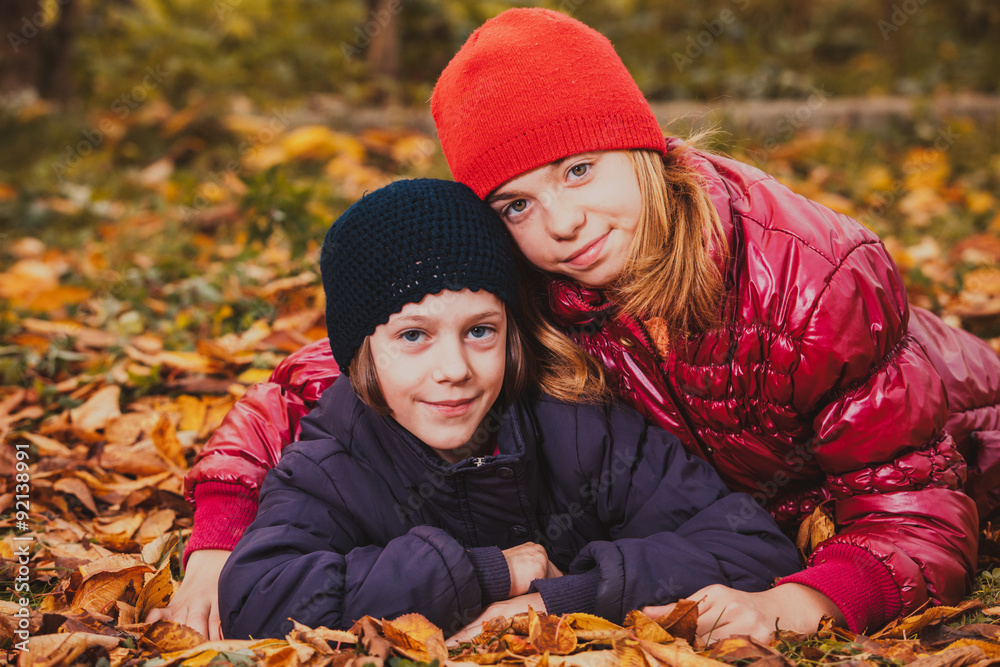 Sisters playing with leaves Sisters playing with leaves