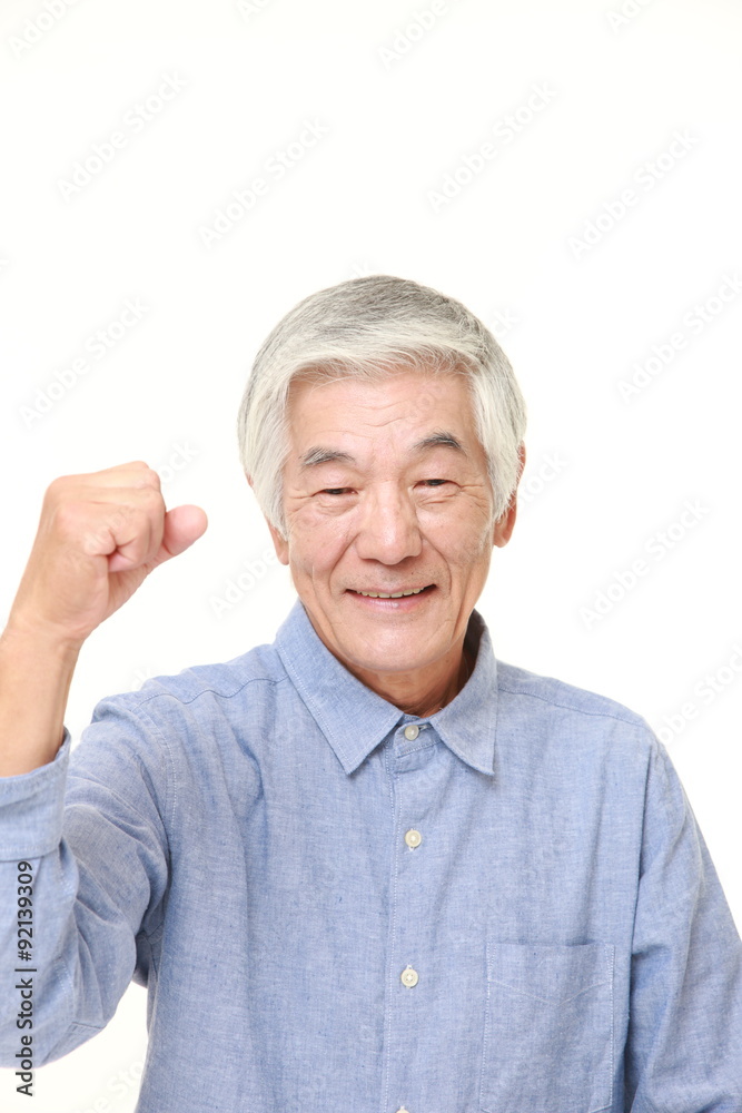 senior Japanese man in a victory pose senior Japanese man in a victory pose