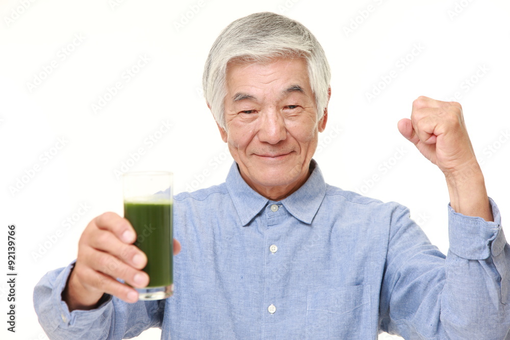 senior Japanese man with green vegetable juice senior Japanese man with green vegetable juice