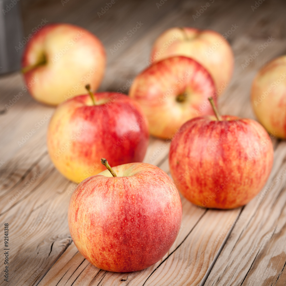 Ripe red apples on wooden table Ripe red apples on wooden table