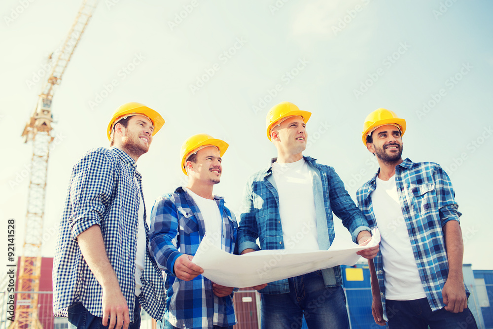 group of builders with tablet pc and blueprint group of builders with tablet pc and blueprint