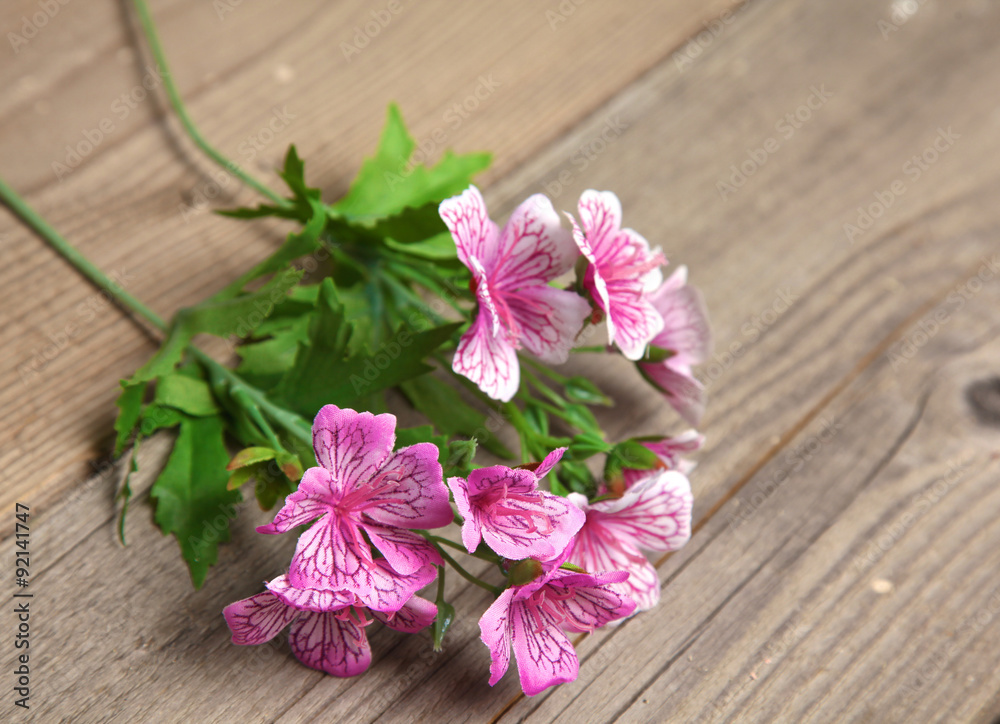 beautiful flowers lie on old wooden table