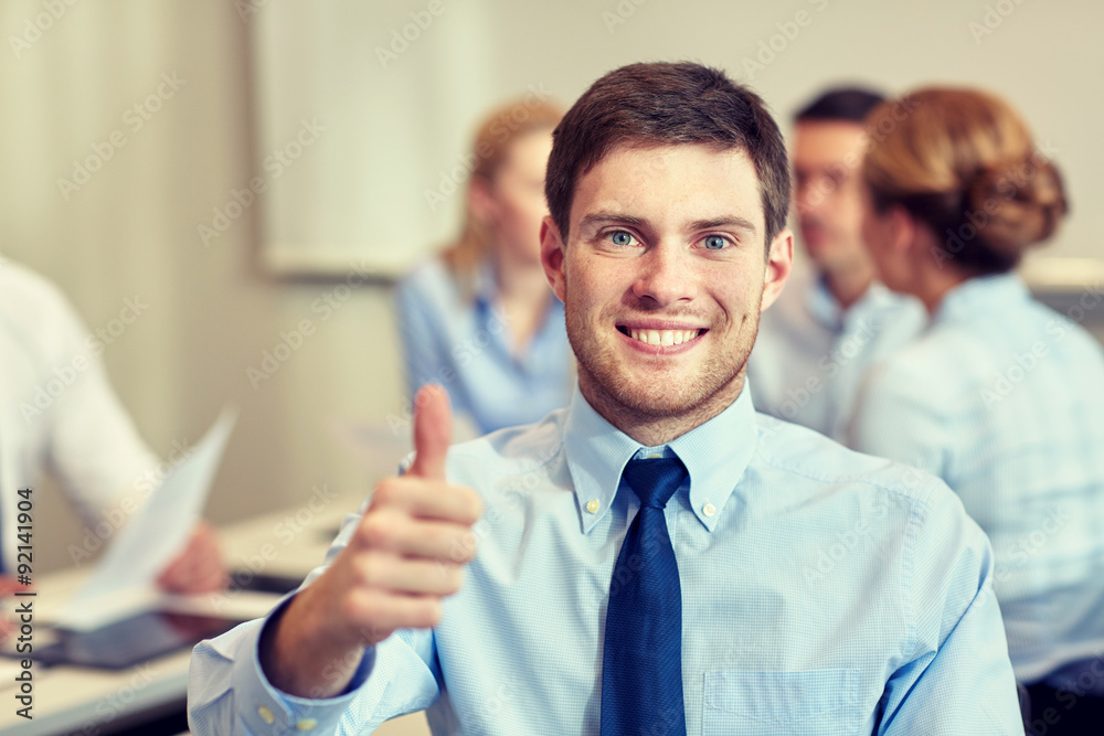 group of smiling businesspeople meeting in office group of smiling businesspeople meeting in office