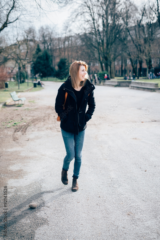 Fototapeta premium young beautiful hipster sporty blonde woman walking in the city,