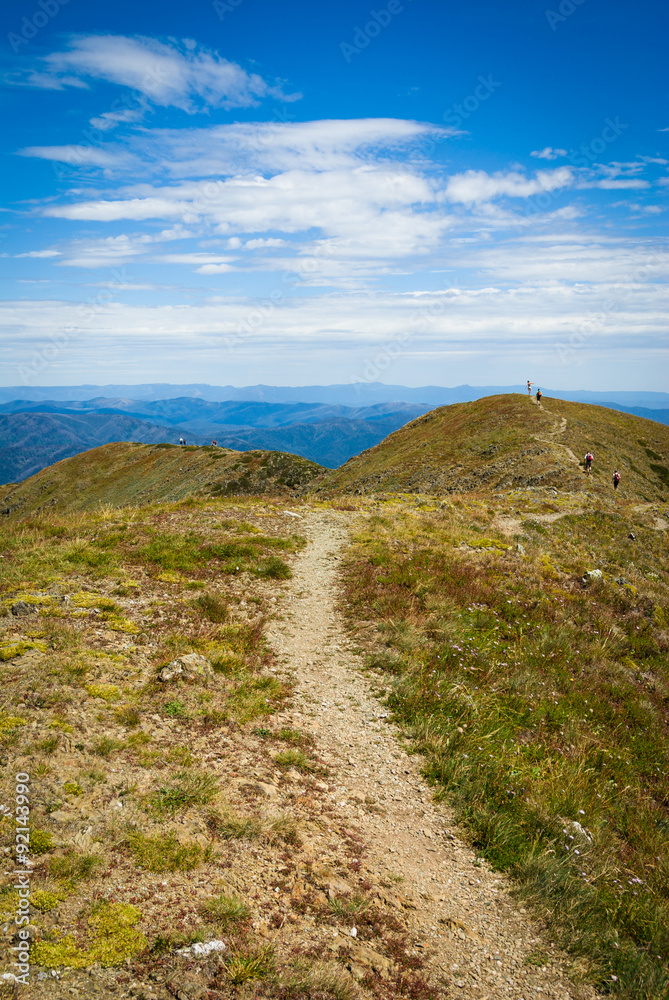 Walking track on ridge of Mt Feathertop, 2nd highest peak in Victorian Alps, Australia Walking track on ridge of Mt Feathertop, 2nd highest peak in Victorian Alps, Australia