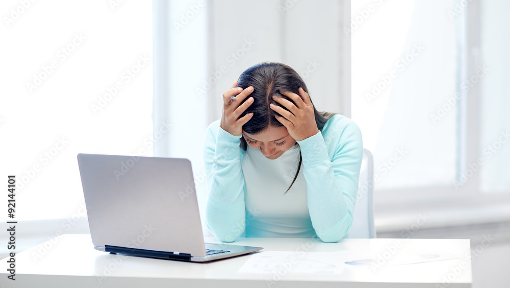 businesswoman with laptop and papers in office businesswoman with laptop and papers in office