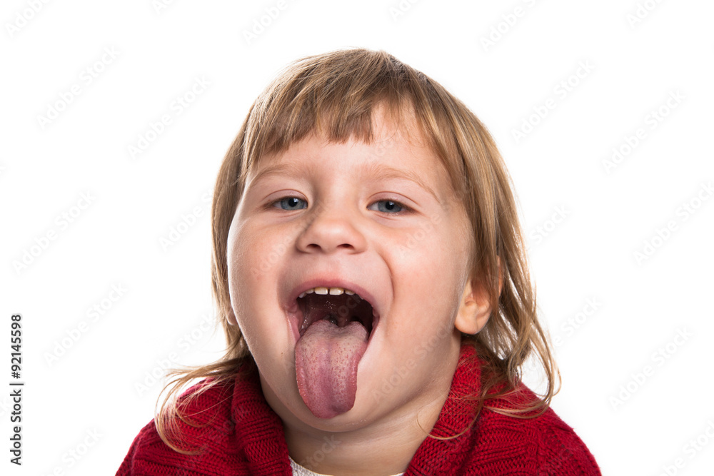 The girl looks in the frame on and showing tongue. Red sweater The girl looks in the frame on and showing tongue. Red sweater