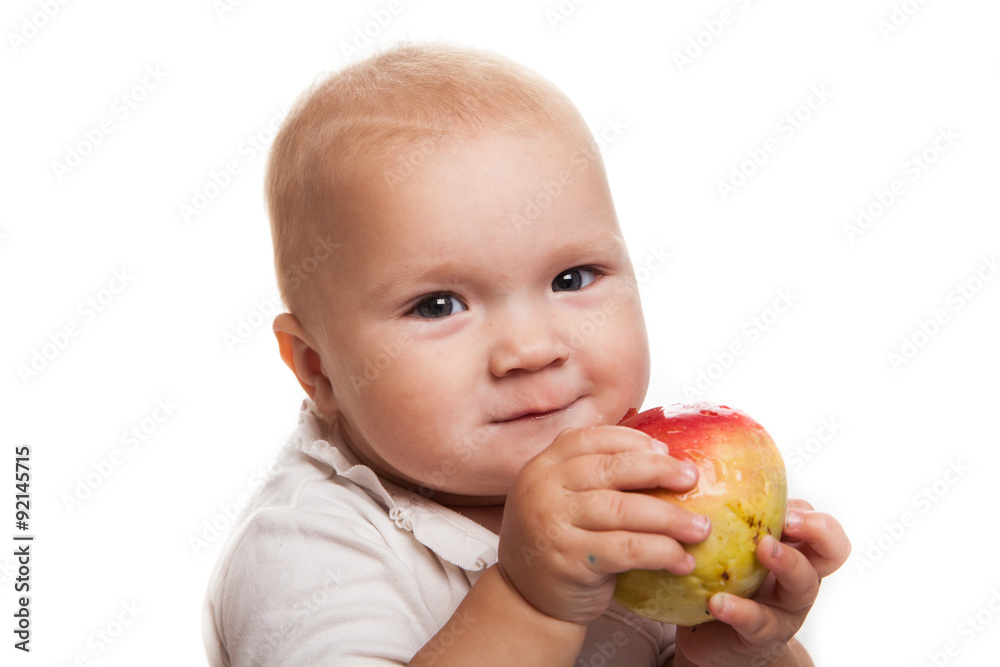 baby with an apple on a white background baby with an apple on a white background